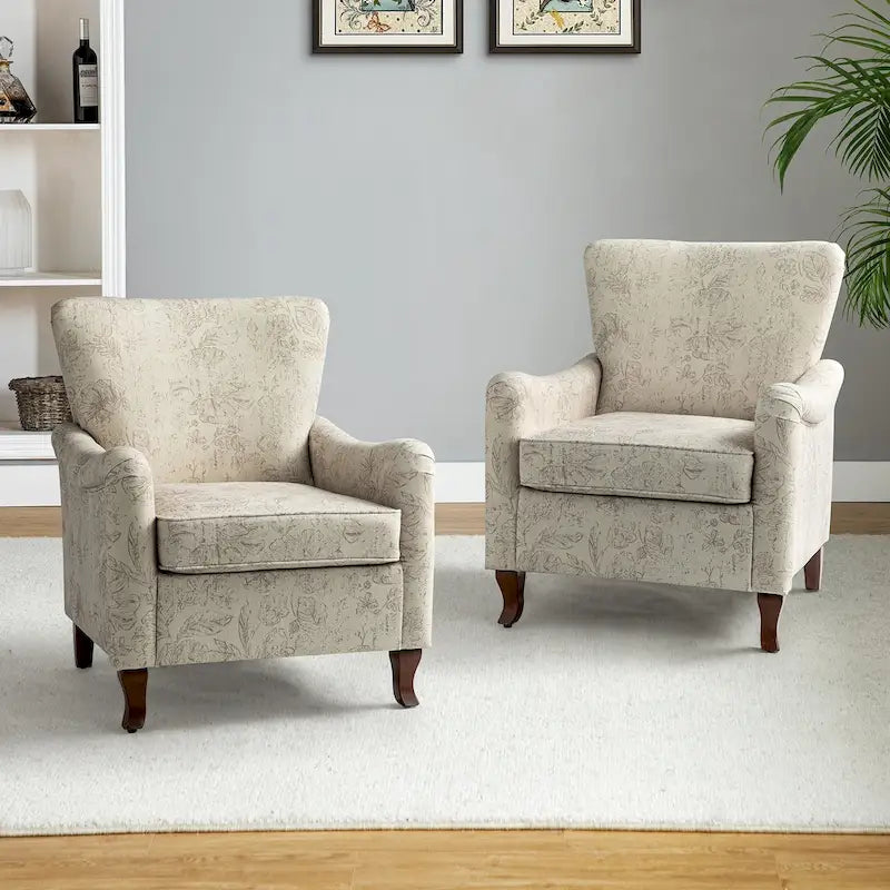 Fauteuils club rembourrés avec motif floral moderne, vendus par lot de deux.