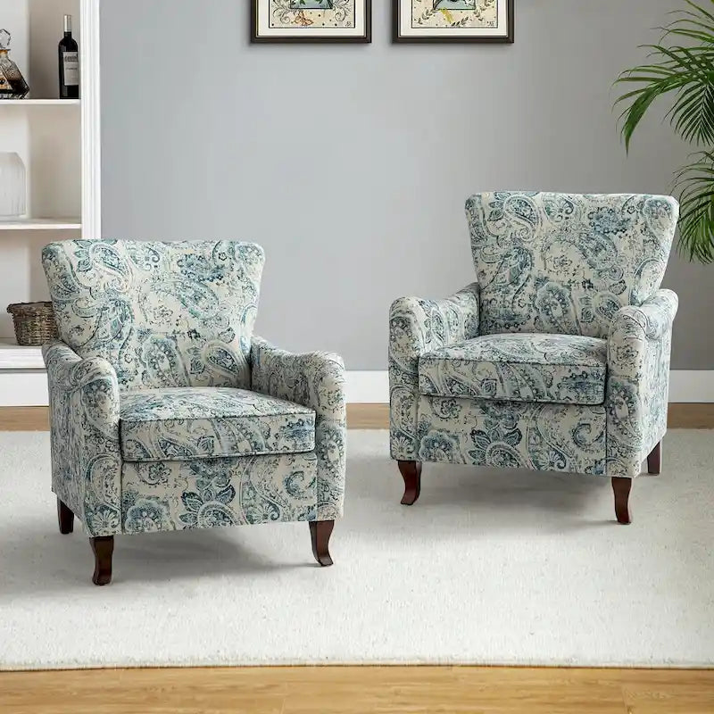 Fauteuils club rembourrés avec motif floral moderne, vendus par lot de deux.